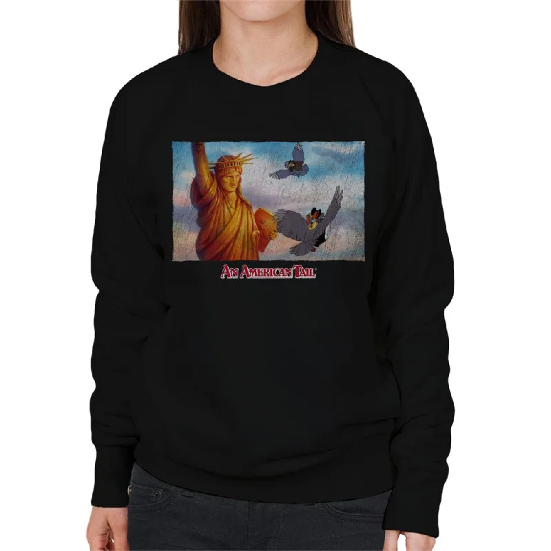 pullover hoodielong-sleeve athletic hoodieAn American Tail Flying Henri Le Pigeon Near Statue Of Liberty Women's Sweatshirt